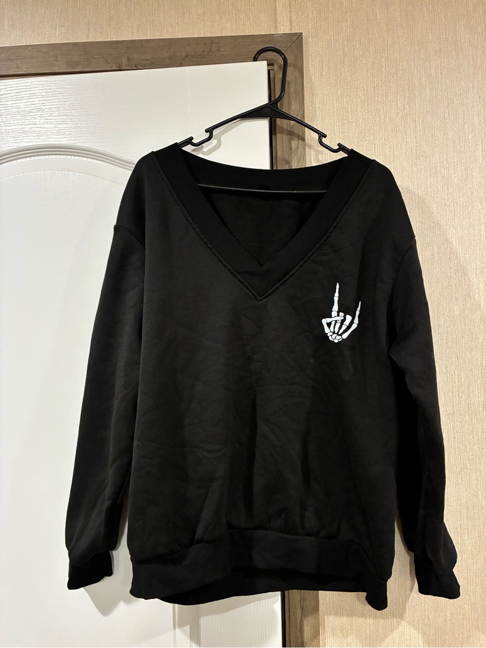SHEIN Black V-Neck Sweater with White Skeleton Hand Graphic